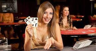 slo2 live-dealer studio with professional setup, multiple cameras, and dealer at blackjack table